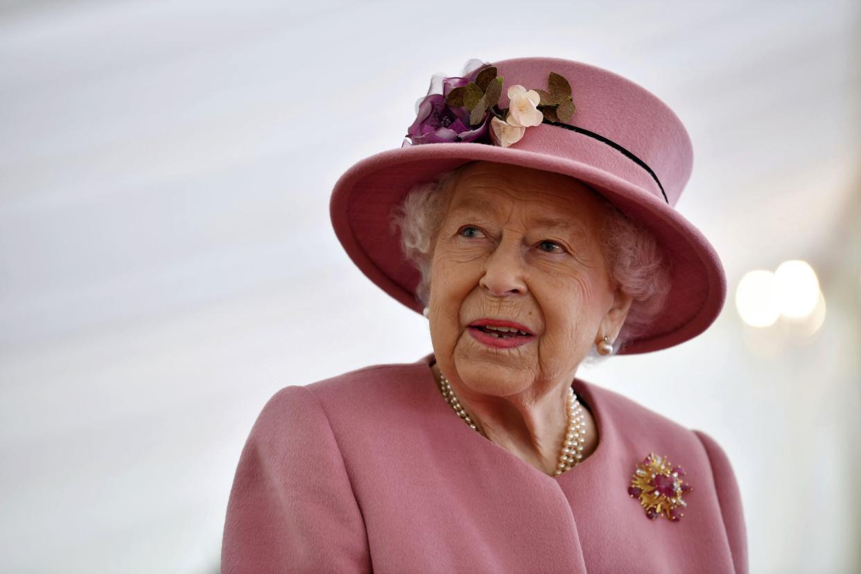 FILE - In this Thursday Oct. 15, 2020 file photo, Britain's Queen Elizabeth II visits the Defence Science and Technology Laboratory (DSTL) at Porton Down, England. 