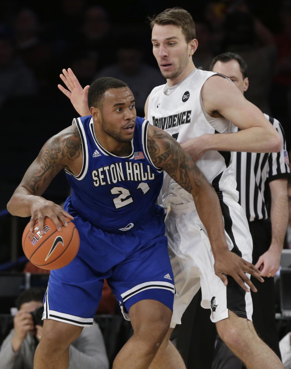 Seton Hall's Eugene Teague (21) is defended by Providence's Carson Desrosiers during the first half of an NCAA college basketball game in the semifinals of the Big East Conference men's tournament Friday, March 14, 2014, at Madison Square Garden in New York. (AP Photo/Frank Franklin II)