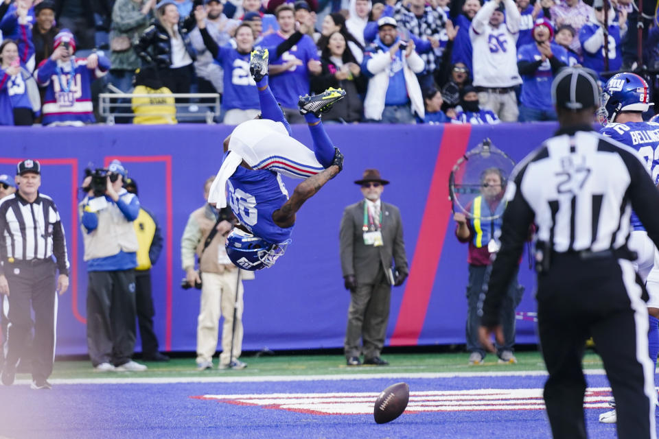 New York Giants' Richie James (80) does a flip as he celebrates after scoring a touchdown during the first half of an NFL football game against the Indianapolis Colts, Sunday, Jan. 1, 2023, in East Rutherford, N.J. (AP Photo/Seth Wenig)