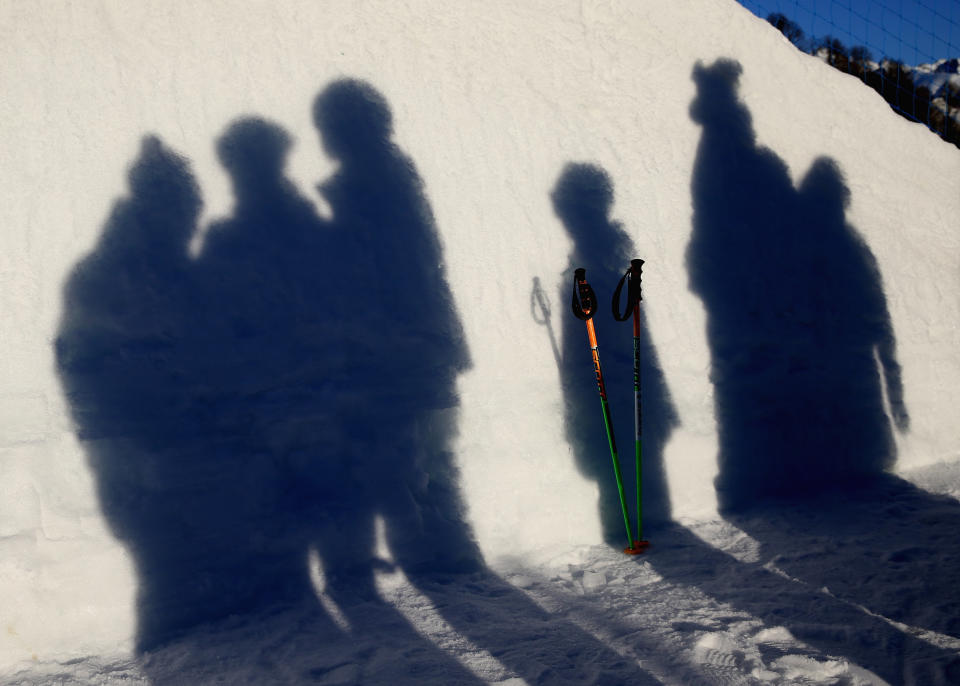 Course workers wait to tend to the Halfpipe during day 1 of the Sochi 2014 Winter Olympics at Rosa Khutor Extreme Park on February 8, 2014 in Sochi, Russia. on February 8, 2014 in Sochi, Russia. 