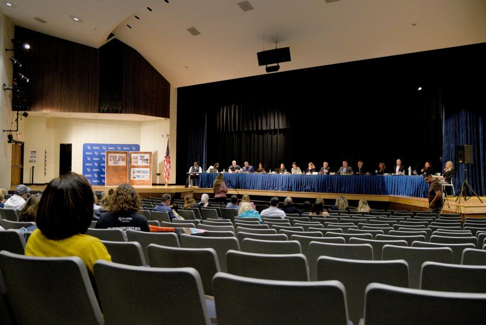 Members of Holmdel Board of Education listen to members of the public debate rescinding the school’s transgender policy on Wednesday, September 20, 2023 at Holmdel High School in Holmdel, New Jersey. The policy is called policy 5756. 