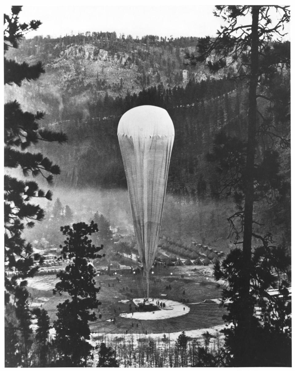 1935 | SOUTH DAKOTA, UNITED STATES: The National Geographic-Army Air Corps stratosphere balloon Explorer II prepares to rise from the Stratobowl near Rapid City, S.D., on Nov 11, 1935. It carried two “aeronauts” 72,395 feet (nearly 14 miles) into the stratosphere — the highest men would go for the next 21 years. (Photo by H. Lee Wells) <br> <br> <a href="http://www.nationalgeographic.com/125/" rel="nofollow noopener" target="_blank" data-ylk="slk:Click here for more info at NationalGeographic.com;elm:context_link;itc:0;sec:content-canvas" class="link ">Click here for more info at NationalGeographic.com</a>