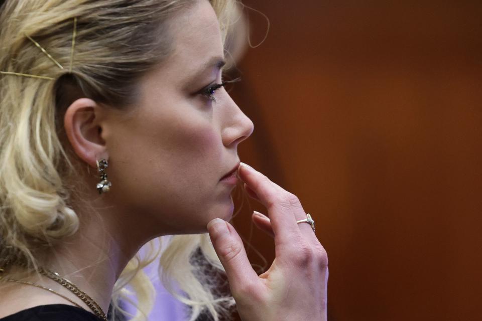 Actor Amber Heard waits before the jury said that they believe she defamed ex-husband Johnny Depp while announcing split verdicts in favor of both her ex-husband Johnny Depp and Heard on their claim and counter-claim in the Depp v. Heard civil defamation trial at the Fairfax County Circuit Courthouse in Fairfax, Virginia, on June 1, 2022. - A US jury on Wednesday found Johnny Depp and Amber Heard defamed each other, but sided far more strongly with the 