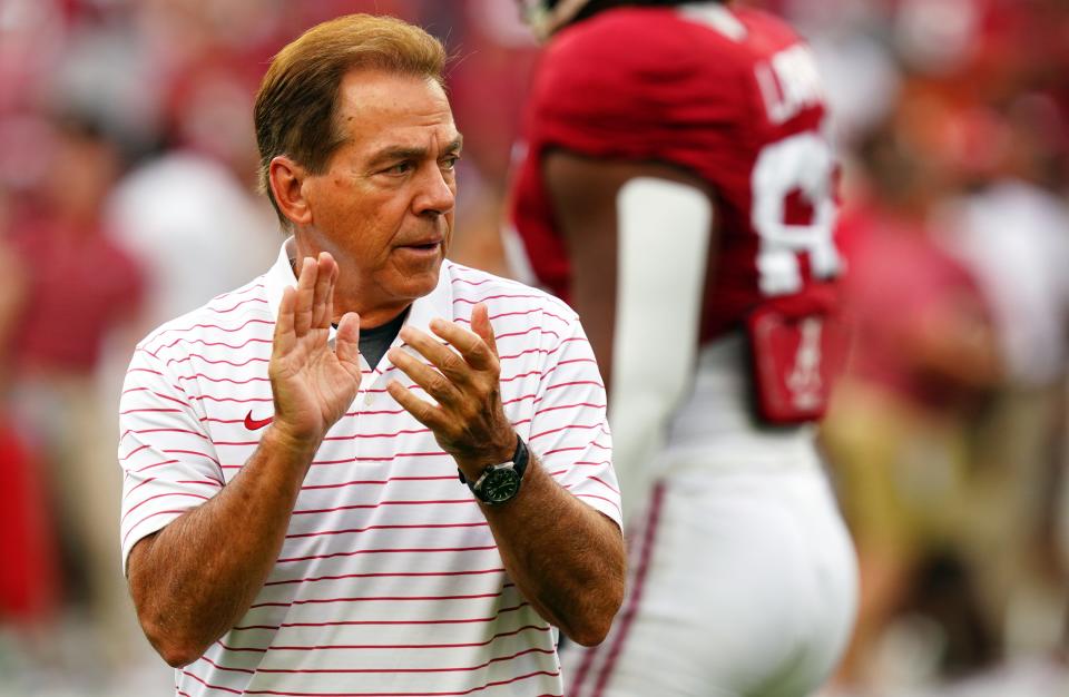 Crimson Tide head coach Nick Saban cheers on his players before their game against the Longhorns at Bryant-Denny Stadium.