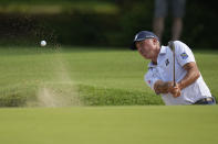 Matt Kuchar hits from the bunker on the seventh hole during the first round of the PGA Championship golf tournament, Thursday, May 19, 2022, in Tulsa, Okla. (AP Photo/Sue Ogrocki)