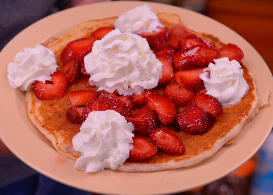 Strawberry season has begun at Strawberry Hill USA in Chesnee. Bethani Cooley McLellan shows a freshly-made Strawberry Pancake Plate at the cafe, Monday, May 9, 2022. 