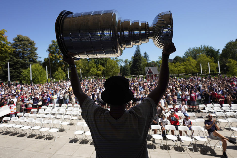 NHL player Nazem Kadri hoist the Stanley Cup during a celebration at Victoria Park in London, Ontario on Saturday Aug. 27, 2022. Kadri, 31, won the cup for the first time while playing with the Colorado Avalanche. (Geoff Robins /The Canadian Press via AP)