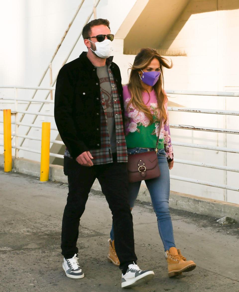 <p>For a cinema trip with her boyfriend Ben Affleck and their kids Lopez wore a festive Christmas jumper, ripped skinny jeans, a bright purple mask, a Coach bag and Timberland boots. </p><p>The singer has been a fan of the footwear style for years and wore a pair of Swarovski embellished versions from the brand's collaboration with Jimmy Choo in 2020. Talk about a Noughties throwback! </p>