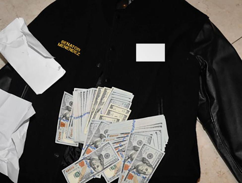 PHOTO: A photo of a jacket and cash from the indictment of Sen. Bob Menendez, found during a 2022 search by federal agents. Investigators found over $480,000 in cash in his New Jersey home. (U.S. Southern District of New York)