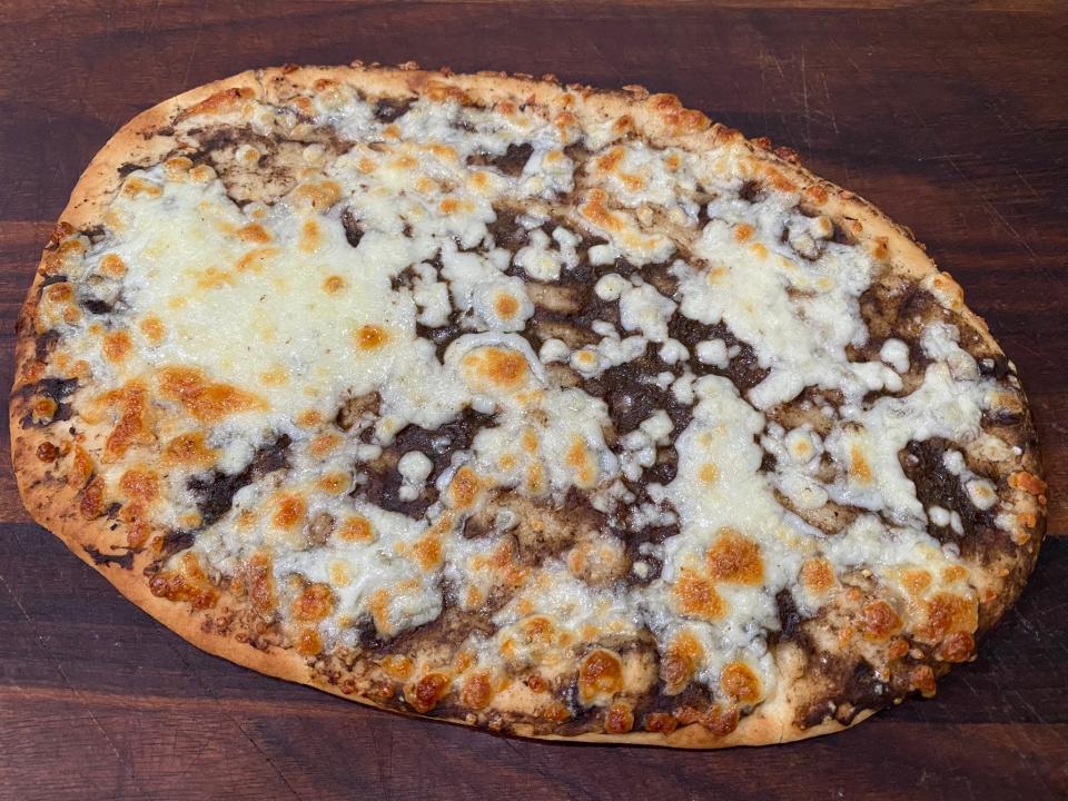 Golden-brown pizza with cheese on top