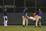 Colorado Rockies security escort fans out who ran out on to the field as Colorado Rockies right fielder Carlos Gonzalez (5) looks on during the 7th inning against the Los Angeles Dodgers August 2, 2016 at Coors Field. (Photo By John Leyba/The Denver Post via Getty Images)