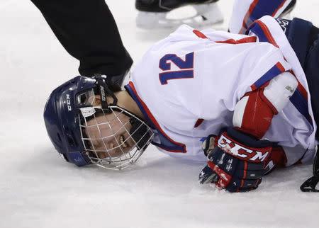 Ice Hockey - Pyeongchang 2018 Winter Olympics - Women’s Classification Match - Sweden v Korea - Kwandong Hockey Centre, Gangneung, South Korea - February 20, 2018 - Kim Hee-won of Korea reacts following an injury. REUTERS/David W Cerny