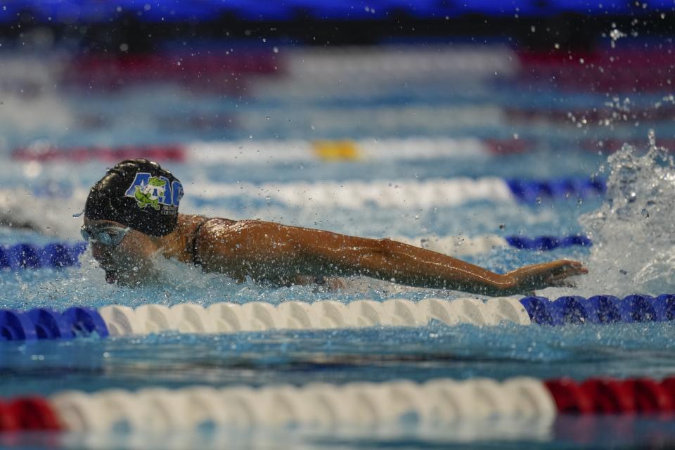 Torri Huske participates in the Women's 100 Butterfly during wave 2 of the U.S. Olympic Swim Trials on Monday, June 14, 2021, in Omaha, Neb. (AP Photo/Jeff Roberson)