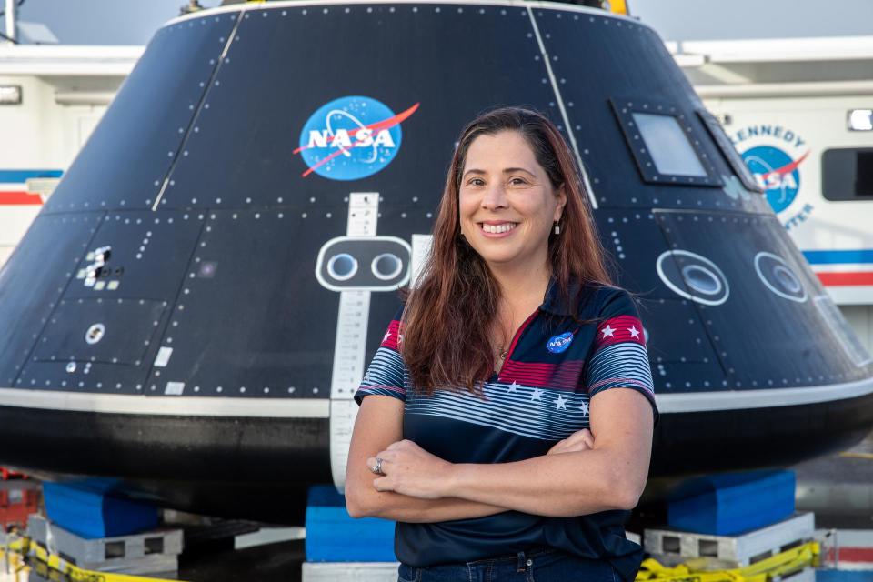 Lili Villarreal, Artemis landing and recovery director with Exploration Ground Systems, stands in front of the Crew Module Test Article in the Launch Complex 39 area at NASA’s Kennedy Space Center in Florida on Feb. 1, 2023.