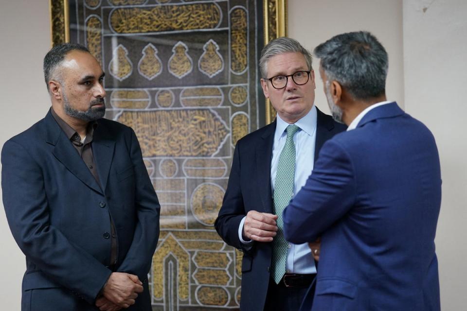 Keir Starmer visits a mosque in Solihull after the riots (Reuters)