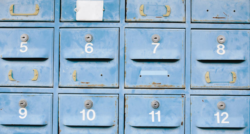 A series of blue letterboxes.