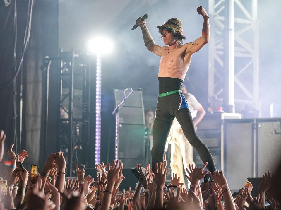 Lead singer of Cage the Elephant, Matt Shultz, is held up by the crowd during their performance during the ALL IN Music and Arts Festival on Sunday, Sept. 4, 2022, at the Indiana State Fairgrounds in Indianapolis. 