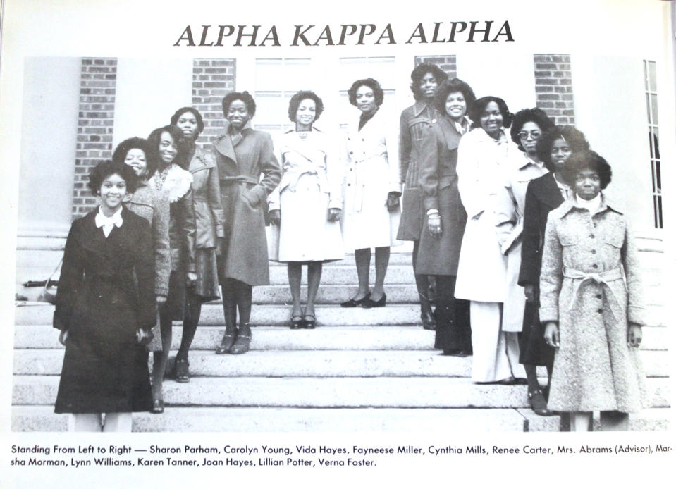 Members of Alpha Kappa Alpha Sorority, Inc. pose in trench coats in 1977. (Photo: William R. & Norma B. Harvey Library Peabody Collection)