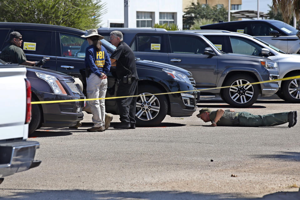 Officials continue to work the scene, Monday, Sept. 2, 2019, in Odessa, Texas, where teenager Leilah Hernandez was fatally shot at a car dealership during Saturday's shooting rampage. (AP Photo/Sue Ogrocki)