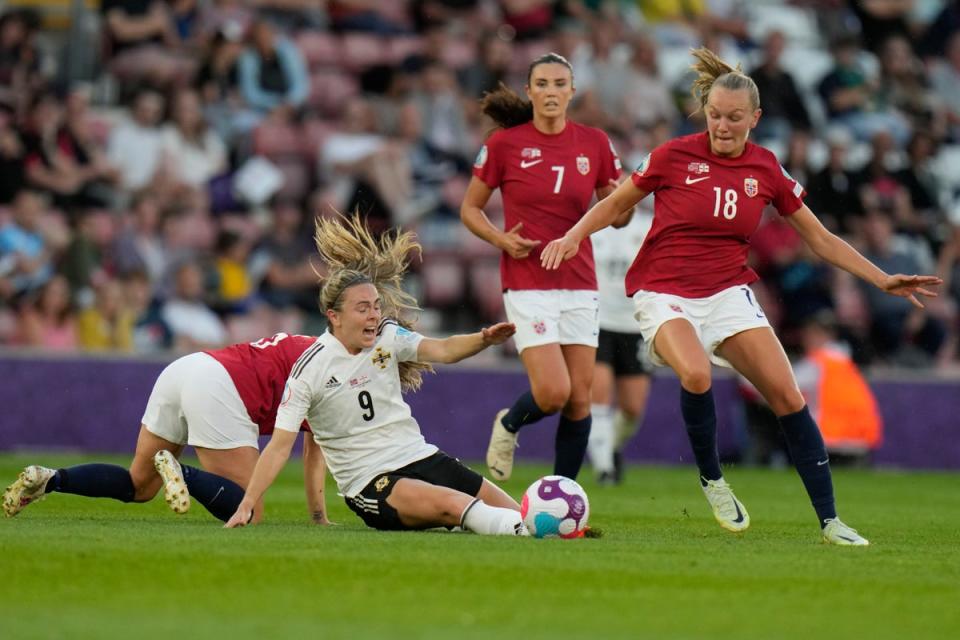 Northern Ireland’s Simone Magill, center, is fouled by Norway’s Maren Mjelde during the Women Euro 2022 soccer match between Norway and Northern Ireland, at the St.Mary’s stadium, in Southampton, Thursday, July 7, 2022. (AP Photo/Alessandra Tarantino) (AP)