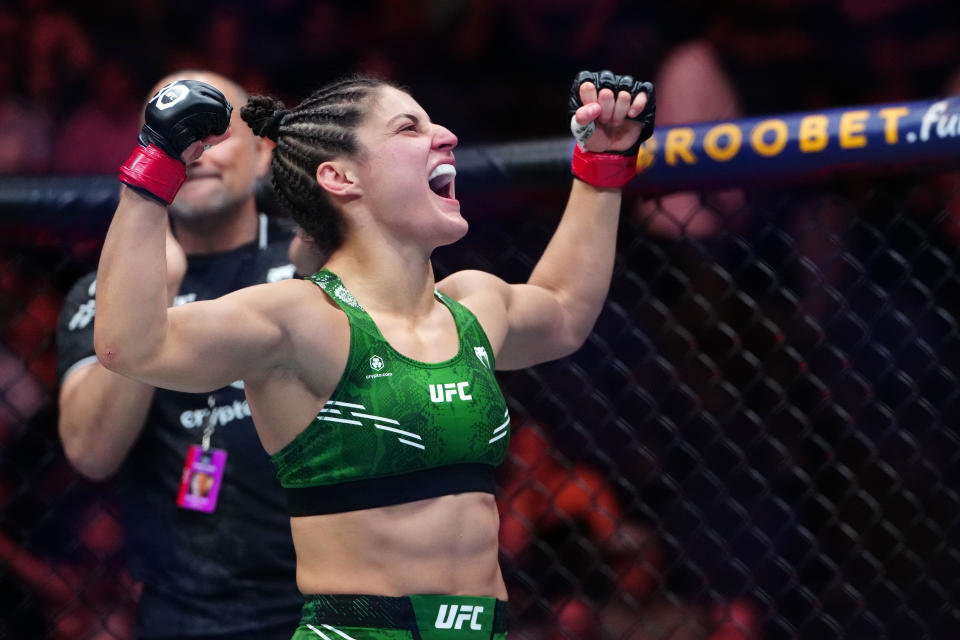 Sep 16, 2023; Las Vegas, Nevada, USA; Loopy Godinez (red gloves) reacts after defeating Elise Reed (not pictured) during UFC Fight Night at T-Mobile Arena. Mandatory Credit: Stephen R. Sylvanie-USA TODAY Sports