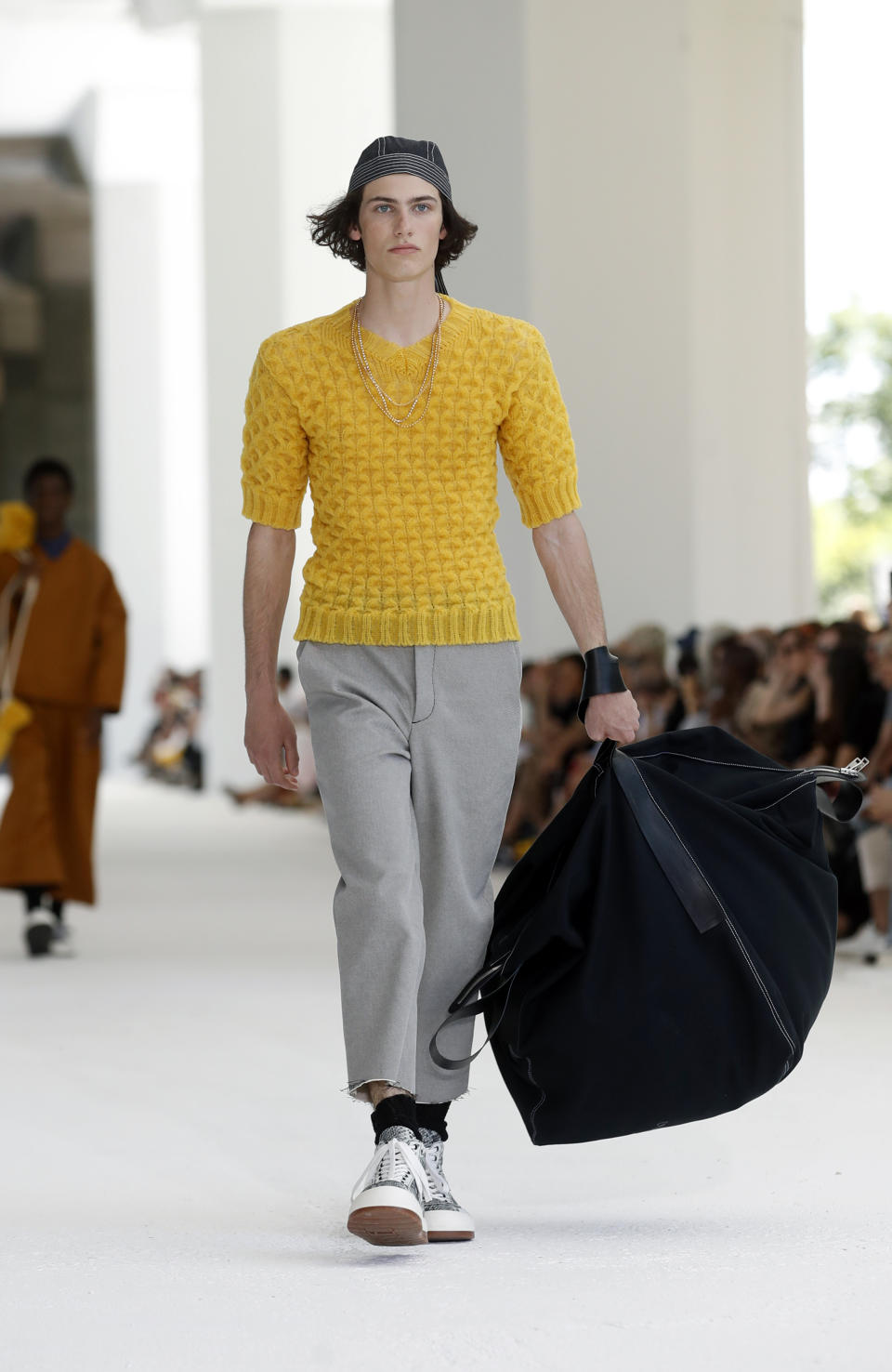 A model wears a creation as part of the Sunnei men's Spring-Summer 2020 collection, unveiled during the fashion week in Milan, Italy, Sunday, June 16, 2019. (AP Photo/Antonio Calanni)