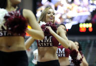 New Mexico State cheerleaders perform during the first half of an NCAA college men's basketball game against Cal State Bakersfield in the semifinals of the West Athletic Conference tournament Friday, March 14, 2014, in Las Vegas. New Mexico State won 69-63. (AP Photo/David Becker)