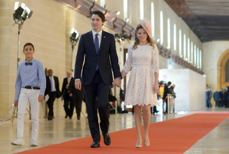 Canadian Prime Minister Justin Trudeau and his wife Sophie Gregoire arrive for the opening ceremony of the Commonwealth Heads of Government Meeting