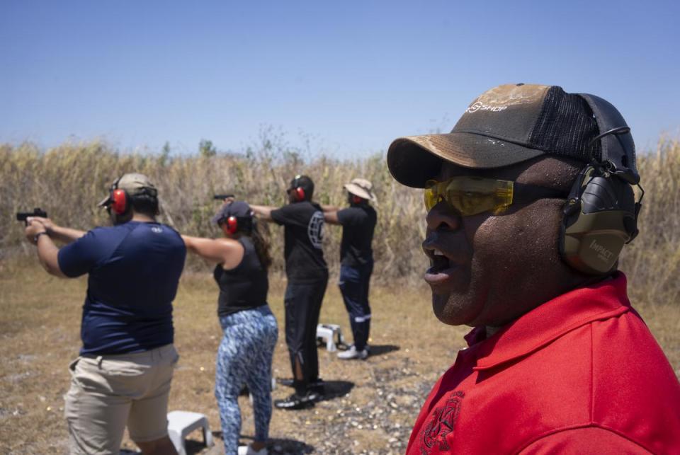 Michael Cargill, owner of Central Texas Gun Works, yells instructions to a group of people during a license-to-carry class at the Lone Star Gun Range in Lockhart on Aug. 5, 2023.