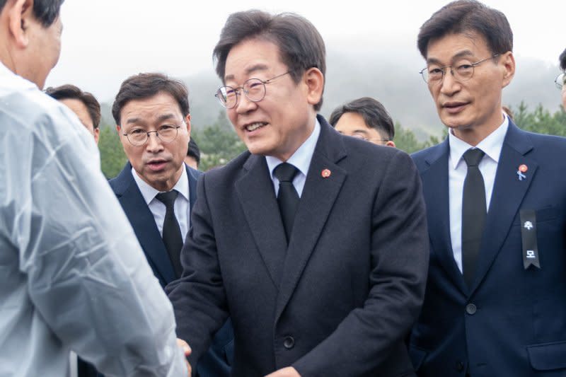 Lee Jae-myung, leader of the liberal Democratic party, shakes hands with attendees at the 76th anniversary of the Jeju 4.3 memorial ceremony at the Jeju 4.3 Peace Park in Jeju City, South Korea, on Wednesday. Photo by Darryl Coote/UPI