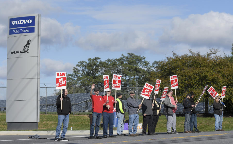 Members of UAW Local 171 picket outside a Mack Trucks facility in Hagerstown, Md. after going on strike Monday, Oct. 9, 2023. Workers voted down a tentative five-year contract agreement that negotiators had reached with the company. (AP Photo/Steve Ruark)