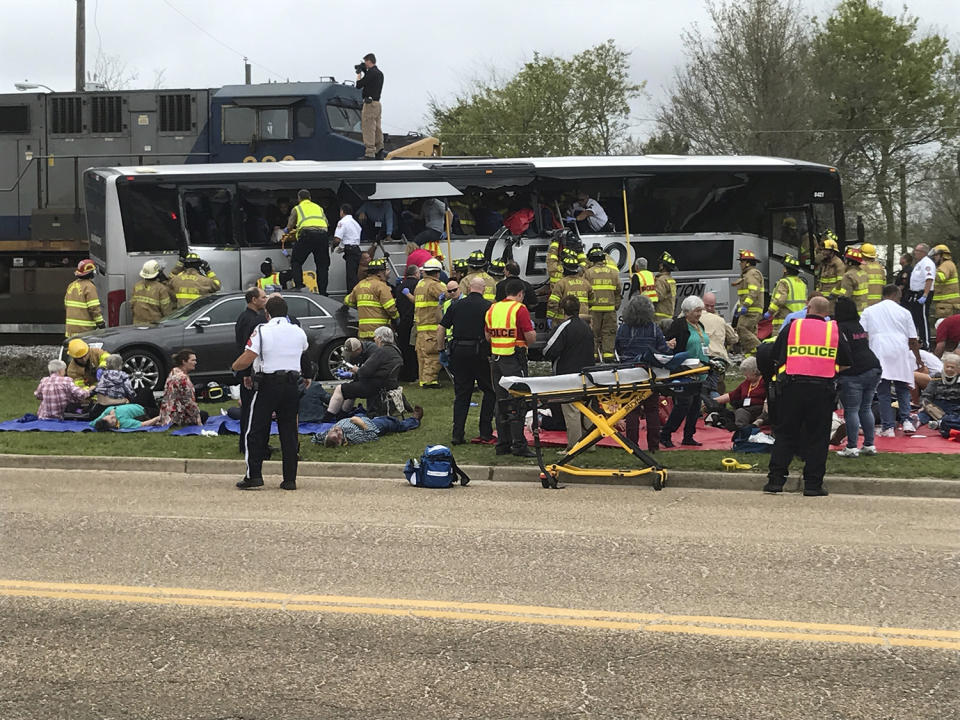 Train hits bus, killing 4