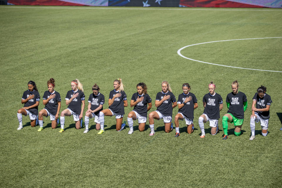 HERRIMAN, UT - JUNE 27: Portland Thorns FC starting XI take a knee before a game between Portland Thorns FC and North Carolina Courage at Zions Bank Stadium on June 27, 2020 in Herriman, UT, Utah. (Photo by Bryan Byerly/ISI Photos/Getty Images)