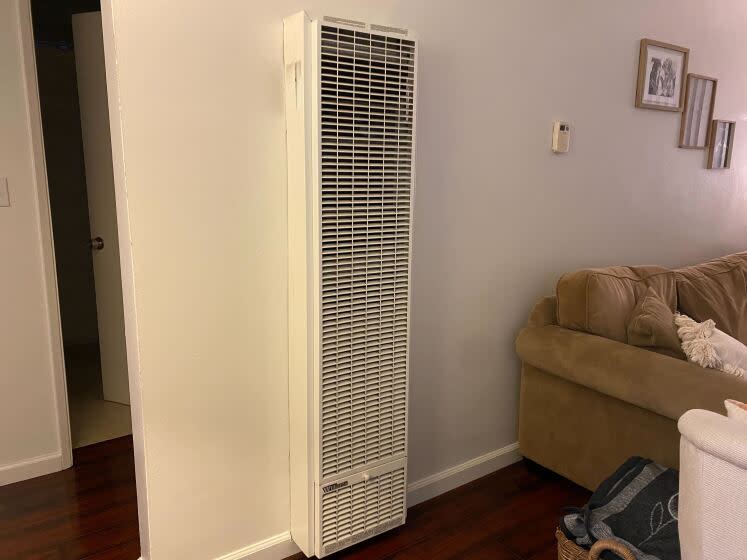 A gas heater installed in the wall of a home