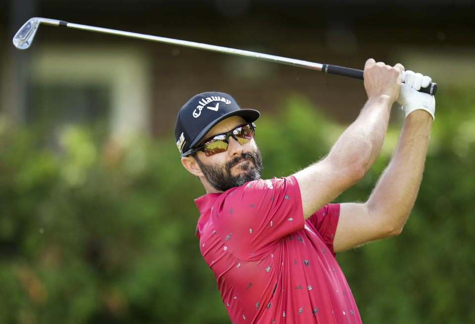 Adam Hadwin watches his tee shot on the 13th hole during the second round of the Canadian Open golf tournament at St. George's on Friday, June 10, 2022, in Toronto. (Nathan Denette/The Canadian Press via AP)