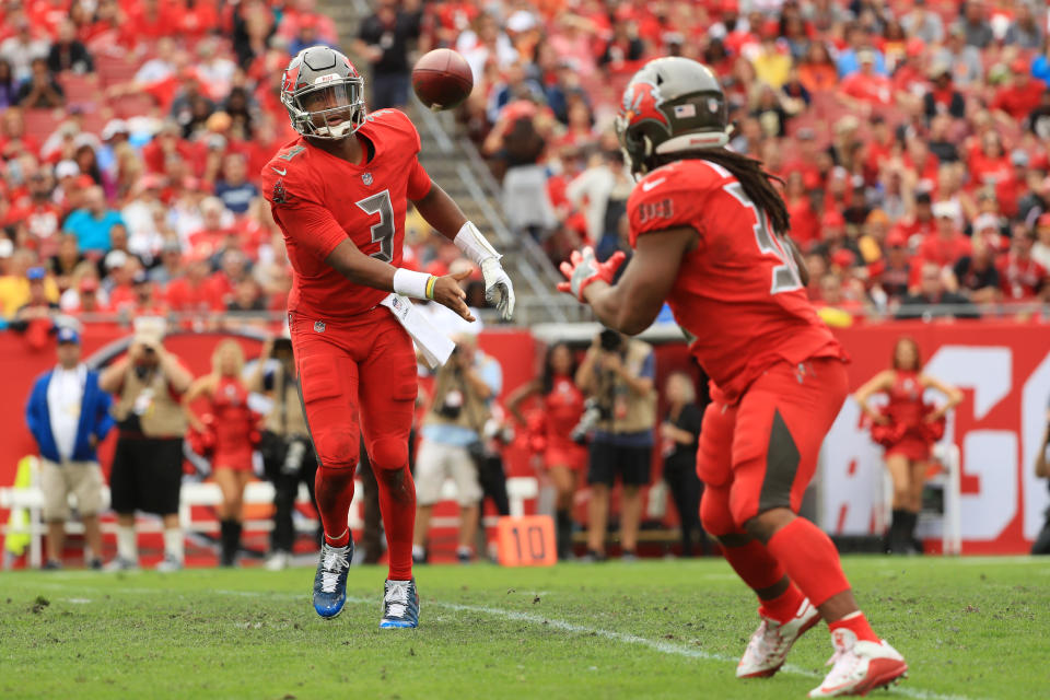 <p>Jameis Winston #3 of the Tampa Bay Buccaneers throws a pass to Jacquizz Rodgers #32 during the third quarter at Raymond James Stadium on December 09, 2018 in Tampa, Florida. (Photo by Mike Ehrmann/Getty Images) </p>