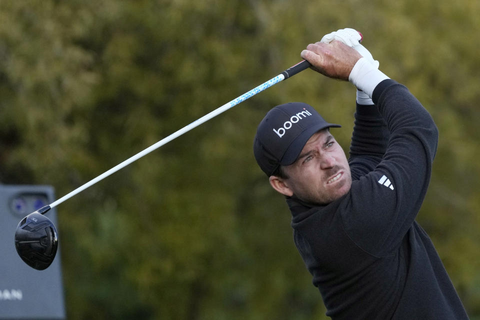 Nick Taylor, of Canada, watches his tee shot on the fifth hole during the third round of the Phoenix Open golf tournament Saturday, Feb. 10, 2024, in Scottsdale, Ariz. (AP Photo/Ross D. Franklin)