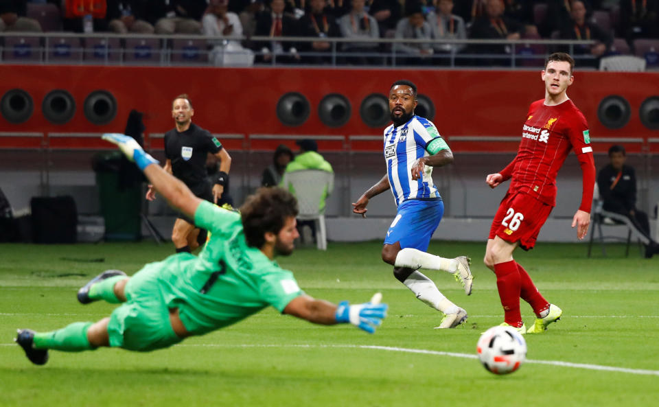 Soccer Football - Club World Cup - Semi Final - Monterrey v Liverpool - Khalifa International Stadium, Doha, Qatar - December 18, 2019  Monterrey's Dorlan Pabon has a shot saved by Liverpool's Alisson     REUTERS/Corinna Kern