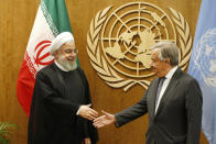 Iran's President Hassan Rouhani, left, meets with United Nations Secretary-General Antonio Guterres during the 74th session of the U.N. General Assembly, at U.N. headquarters, Wednesday, Sept. 25, 2019. (AP Photo/Jason DeCrow)