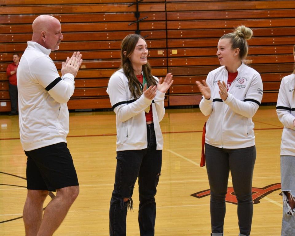 Port Clinton's Kami Periat is recognized for her state crown. Coach Dan Diaz and assistant Emily Shaw join Periat.