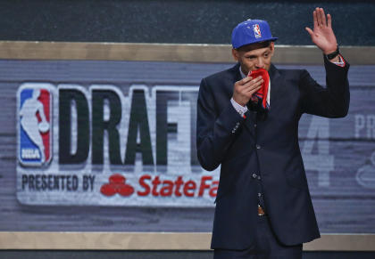 Isaiah Austin waves to the crowd after being granted ceremonial first-round pick. (AP)