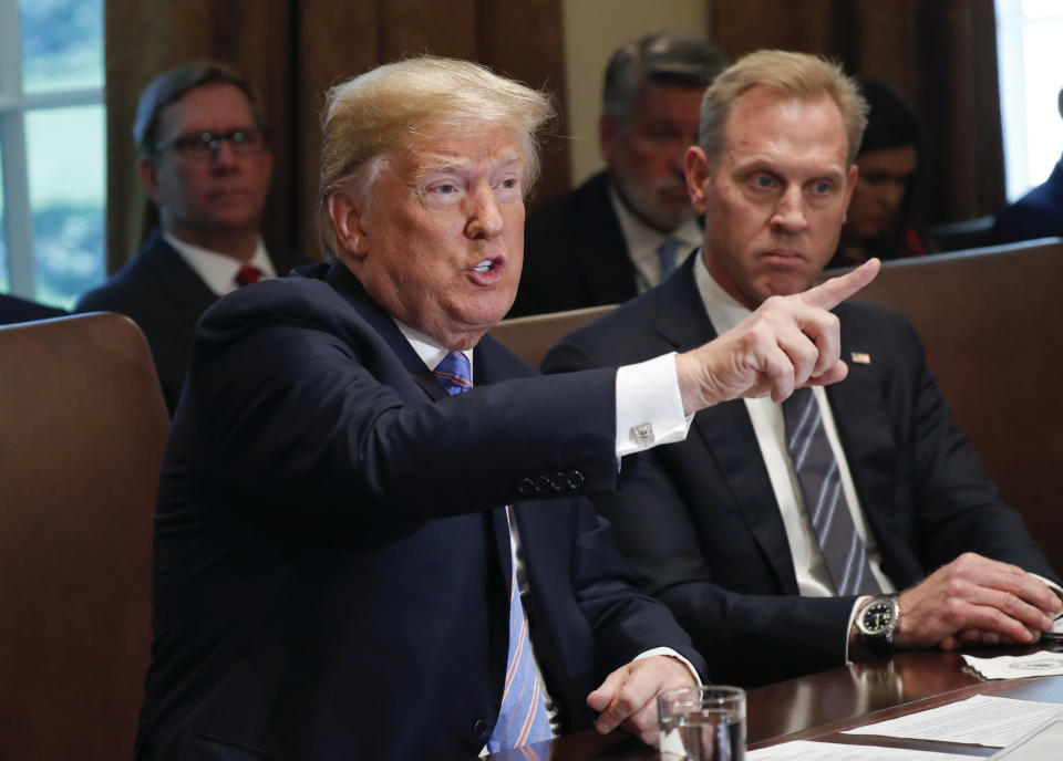 President Trump gestures during a meeting at the White House on Wednesday with members of his Cabinet. Looking on is Deputy Secretary of Defense Patrick Shanahan. (Photo: Pablo Martinez Monsivais/AP)