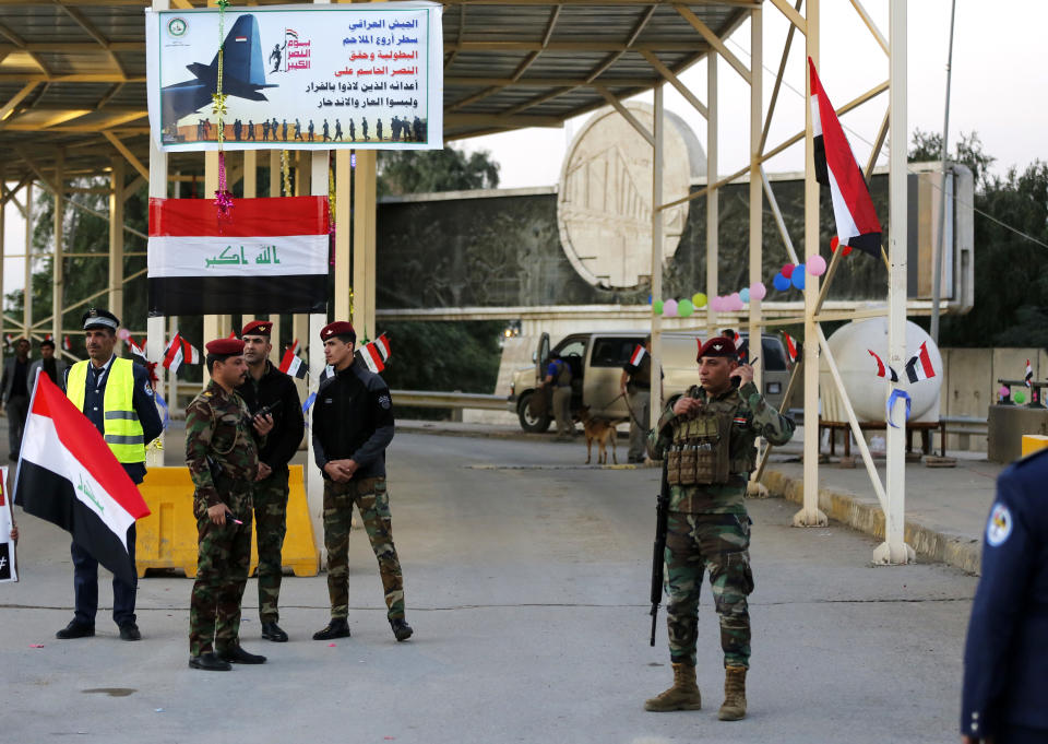 FILE - In this Dec. 10, 2018 file photo, Iraqi security forces stand guard as they check motorists entering the Green Zone, in Baghdad, Iraq. The Green Zone has been a barometer for tension and conflict in Iraq for nearly two decades. The 4-square mile (10-square kilometer), heavily guarded strip on the Tigris River was known as "Little America" following the 2003 U.S.-led invasion that toppled dictator Saddam Hussein. It then became a hated symbol of the country's inequality, fueling the perception among Iraqis that their government is out of touch. (AP Photo/Karim Kadim, File)