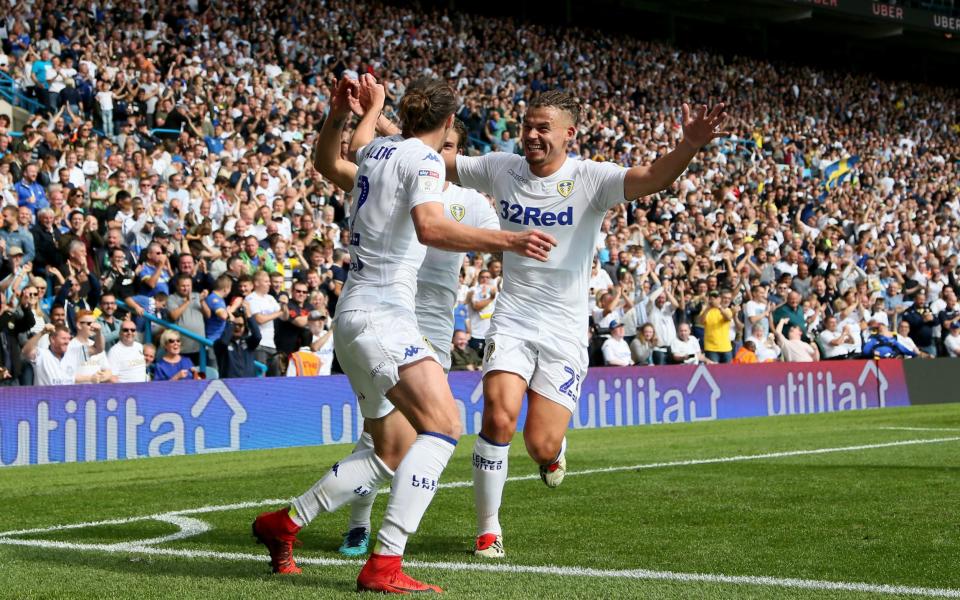 Luke Ayling celebrates scoring the first goal for Leeds - PA