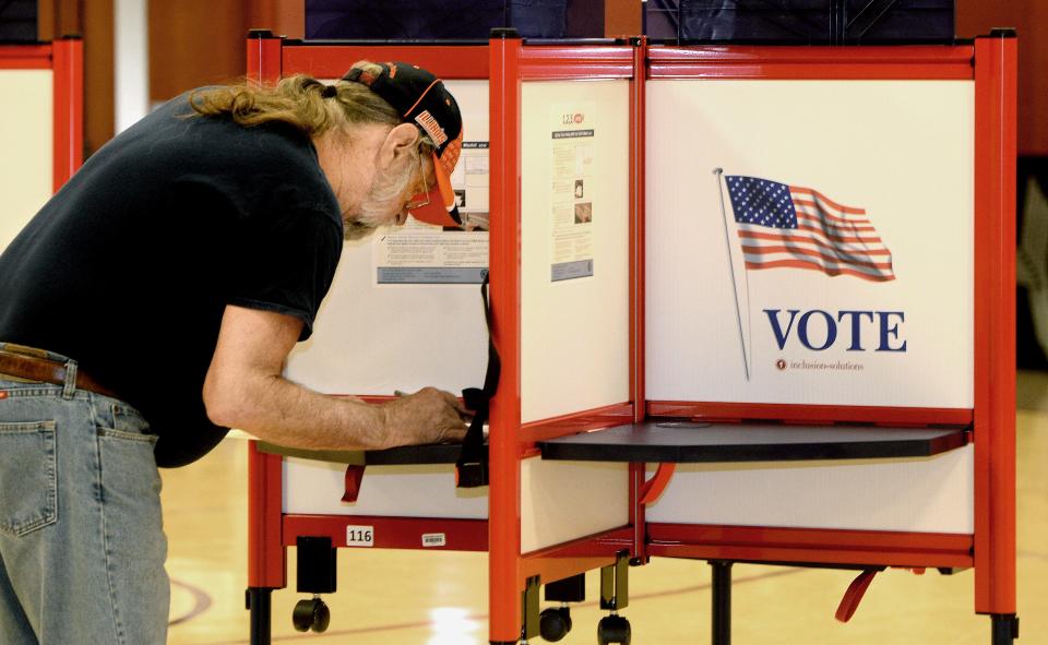 Mark Burton votes in Tuesday's primary at Union Baptist Church in Springfield.