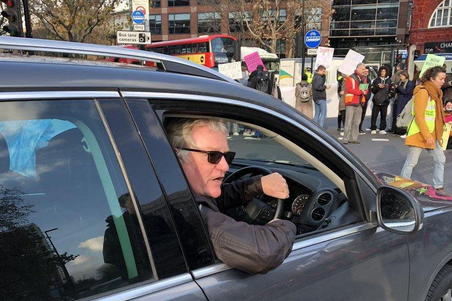 Comedian Jim Davidson was held up by a 'swarm' of protesters (Tom Edwards/BBC London)