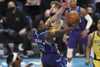 Charlotte Hornets guard Terry Rozier drives to the basket against Indiana Pacers forward Domantas Sabonis during the second half of an NBA basketball game in Charlotte, N.C., Wednesday, Jan. 27, 2021. (AP Photo/Nell Redmond)