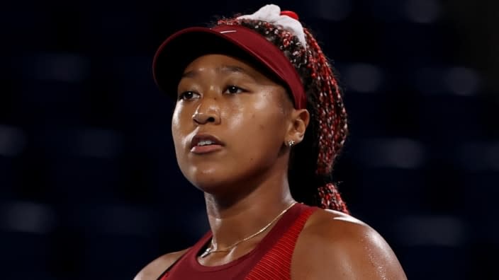 Tennis player Naomi Osaka of Team Japan prepares to serve during her women’s singles third-round match in Day Four of the Tokyo 2020 Olympic Games. (Photo by David Ramos/Getty Images)