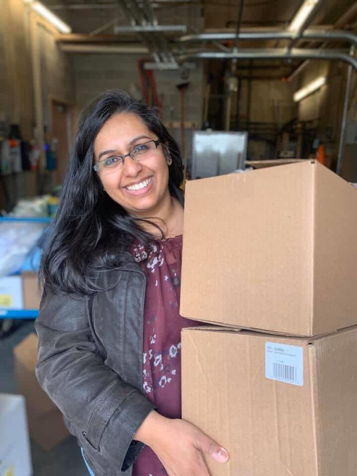 Dr. Nadia Alam holding a box of donated medical supplies by the community of Halton Hills.