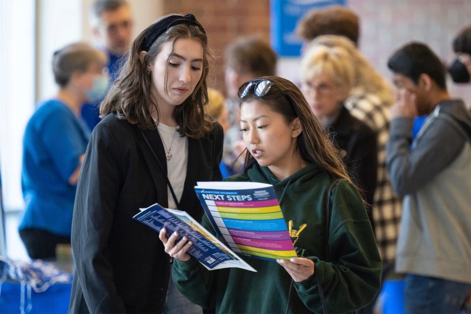 Prospective MTSU students review university promotional materials during the spring True Blue Preview campus tour. (MTSU photo)